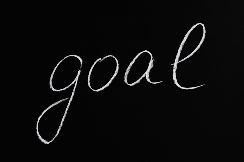 goal lettering text on black background